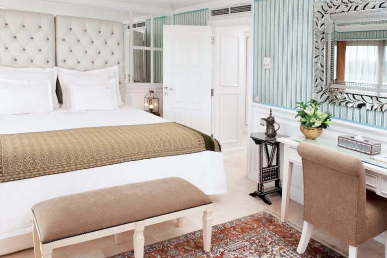 Cabin bed with desk, mirror and potted plant