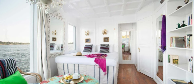 Cabin bed with white shelves and open doorway