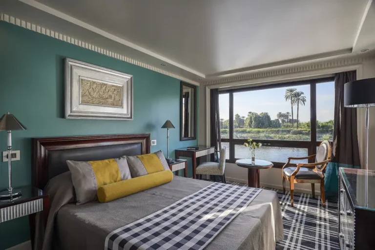 Double cabin with teal wall and Nile view window on the Sun Ray