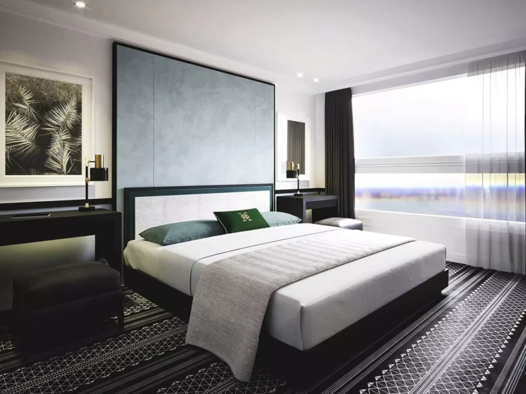Double bed and wide window in a Movenpick MS Hamees cabin