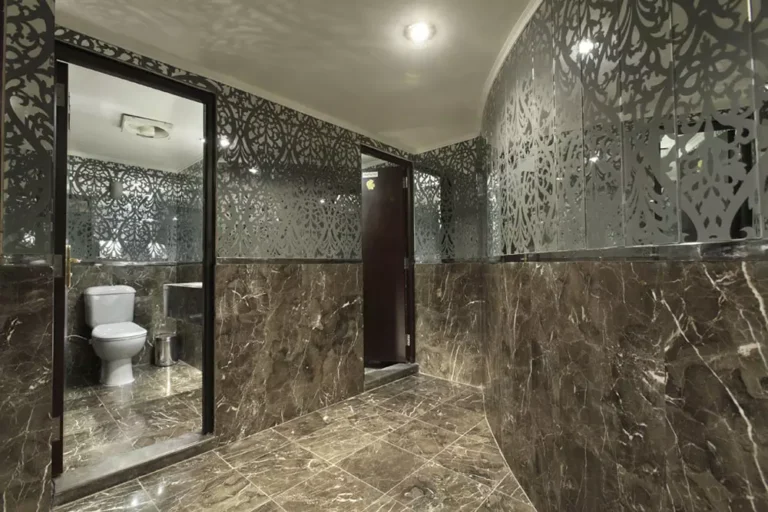 Marble restroom with patterned mirror walls, Movenpick MS Hamees
