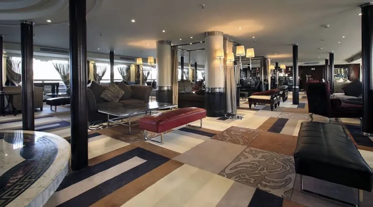 Movenpick MS Hamees lounge with patterned floor and dark pillars