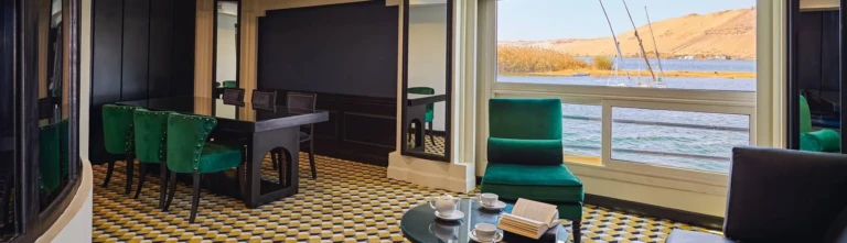 Suite dining table and armchair by the river window, Movenpick MS Hamees