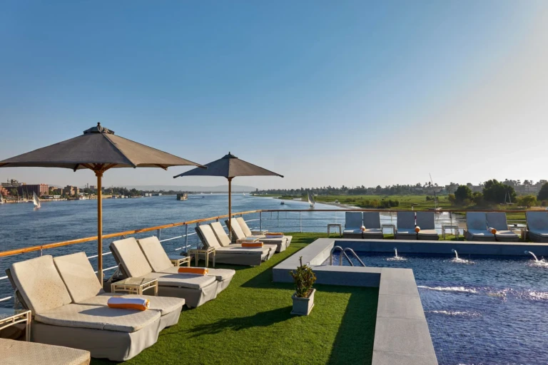 Sun loungers, parasols and pool on the Royal Lily deck