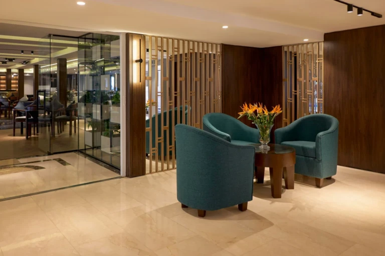 Teal armchairs in the Royal Lily lobby lounge