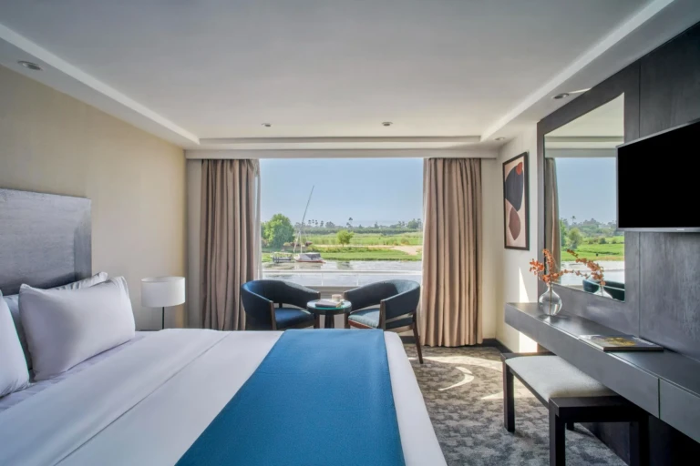 Royal Lily cabin with double bed and window seating facing the Nile
