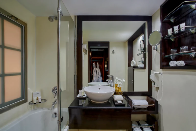 Royal Lily bathroom with vessel sink, mirror and shower
