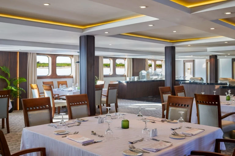 Royal Lily restaurant with white-clothed tables and round windows