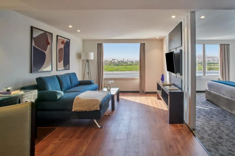 Royal Lily suite living room with blue sofa and Nile view