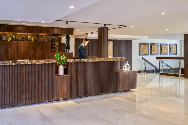 Royal Lily reception desk with wood panelling