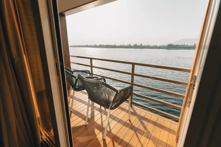 Private balcony with two chairs overlooking the Nile on the Nebu
