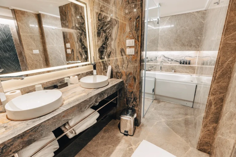Marble bathroom with double sinks and bathtub on the Nebu