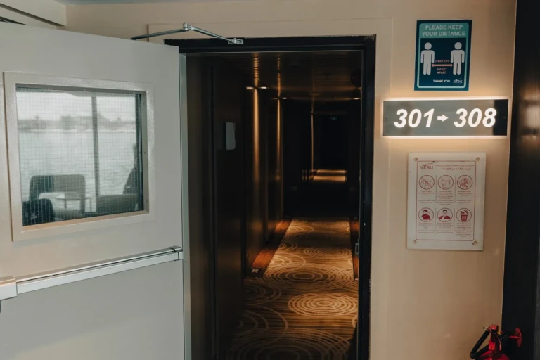 Cabin corridor entrance marked 301 to 308 on the Nebu