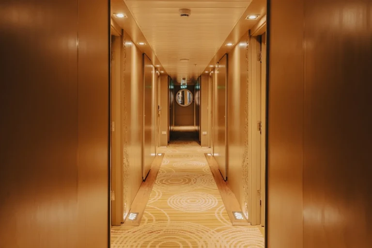Wood-panelled cabin corridor on the Nebu