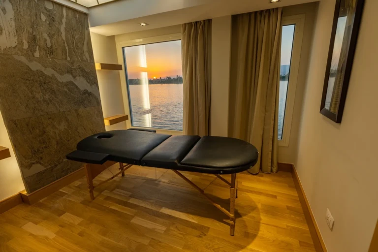 Nebu massage room with treatment table and a sunset Nile view
