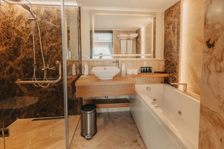 Bathroom with glass shower, jetted tub and vanity on the Nebu
