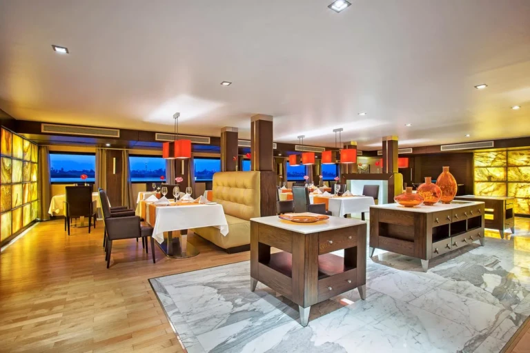 Oberoi Zahra dining room with Nile view windows and buffet counters