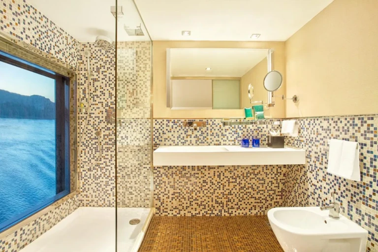 Mosaic-tiled bathroom with walk-in shower on the Oberoi Zahra