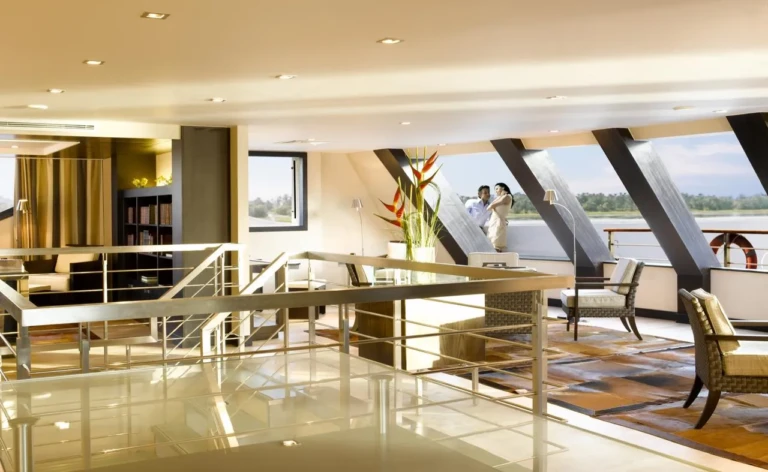 Upper lobby with glass railing and slanted windows on the Oberoi Zahra