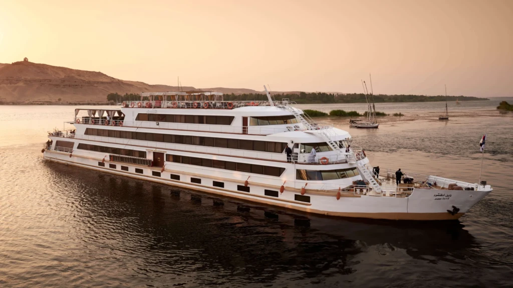 Sanctuary Nile Adventurer cruising at sunset