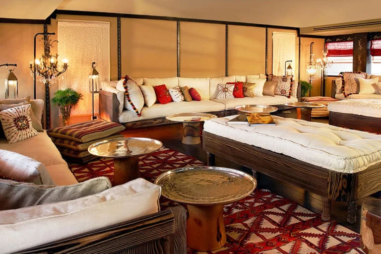 Sun Boat III lounge with daybed, sofas and red patterned rug