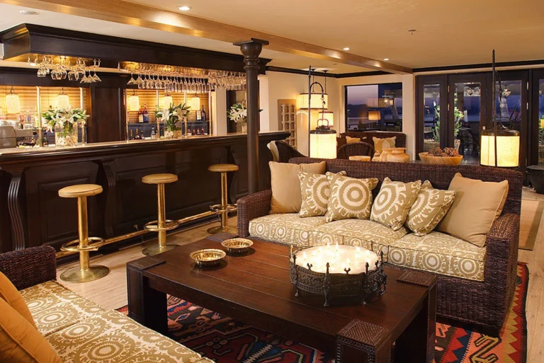 Sun Boat III bar with stools and patterned sofa
