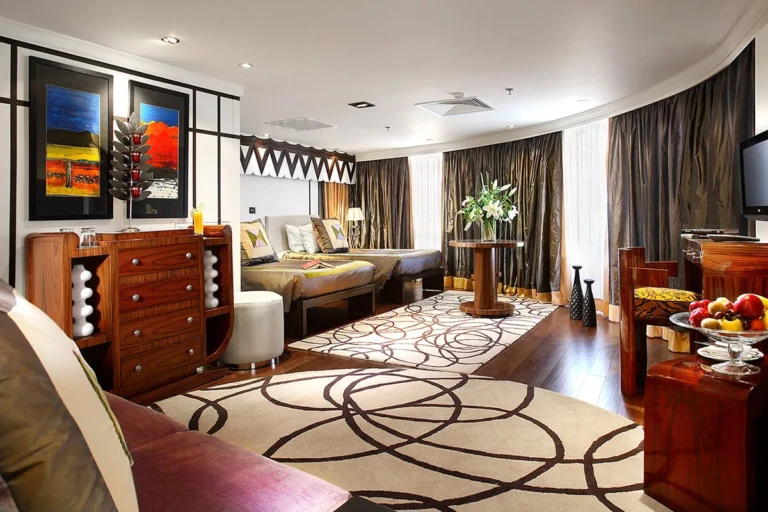 Sun Boat IV suite living area with artwork and patterned rug
