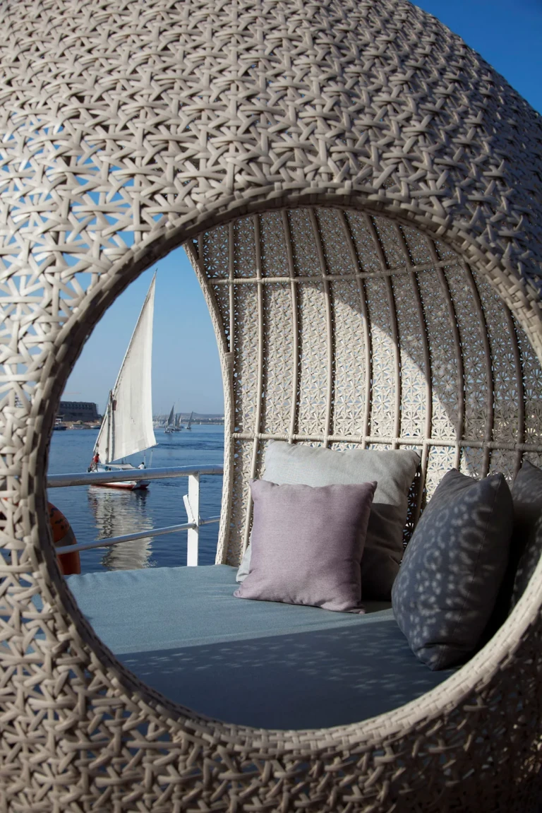 Wicker daybed framing a felucca on the Nile from the Sun Boat IV