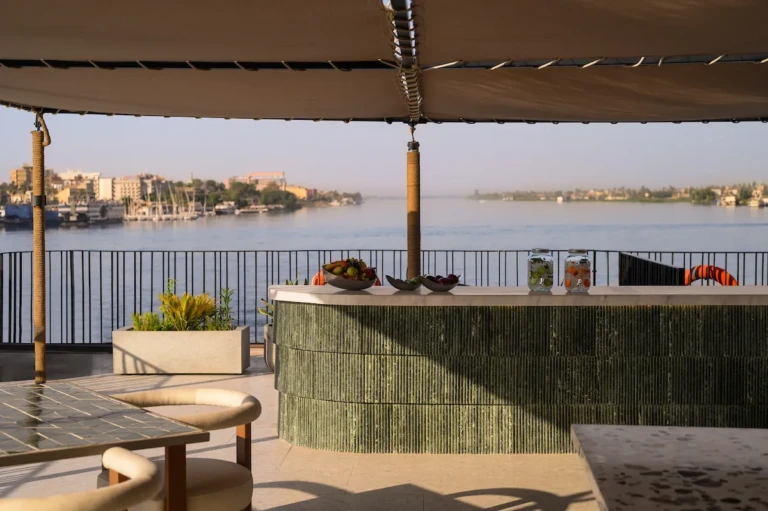 Outdoor bar counter under an awning with Nile riverbank view on the Soleil