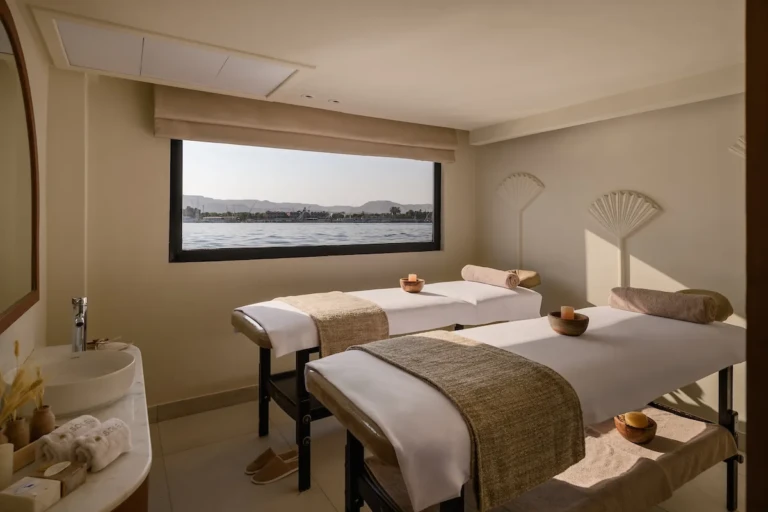 Twin massage tables in the Soleil spa with a Nile window
