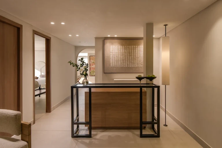 Soleil spa corridor with console table and treatment room doors