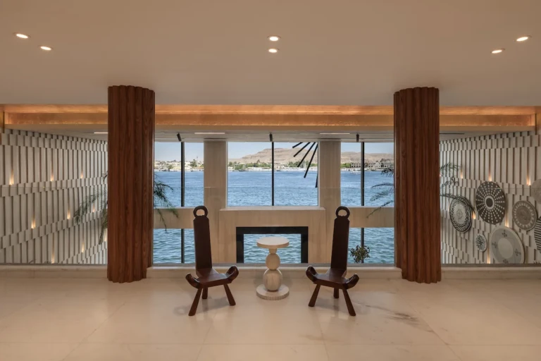 Soleil reception area with two chairs facing Nile view windows