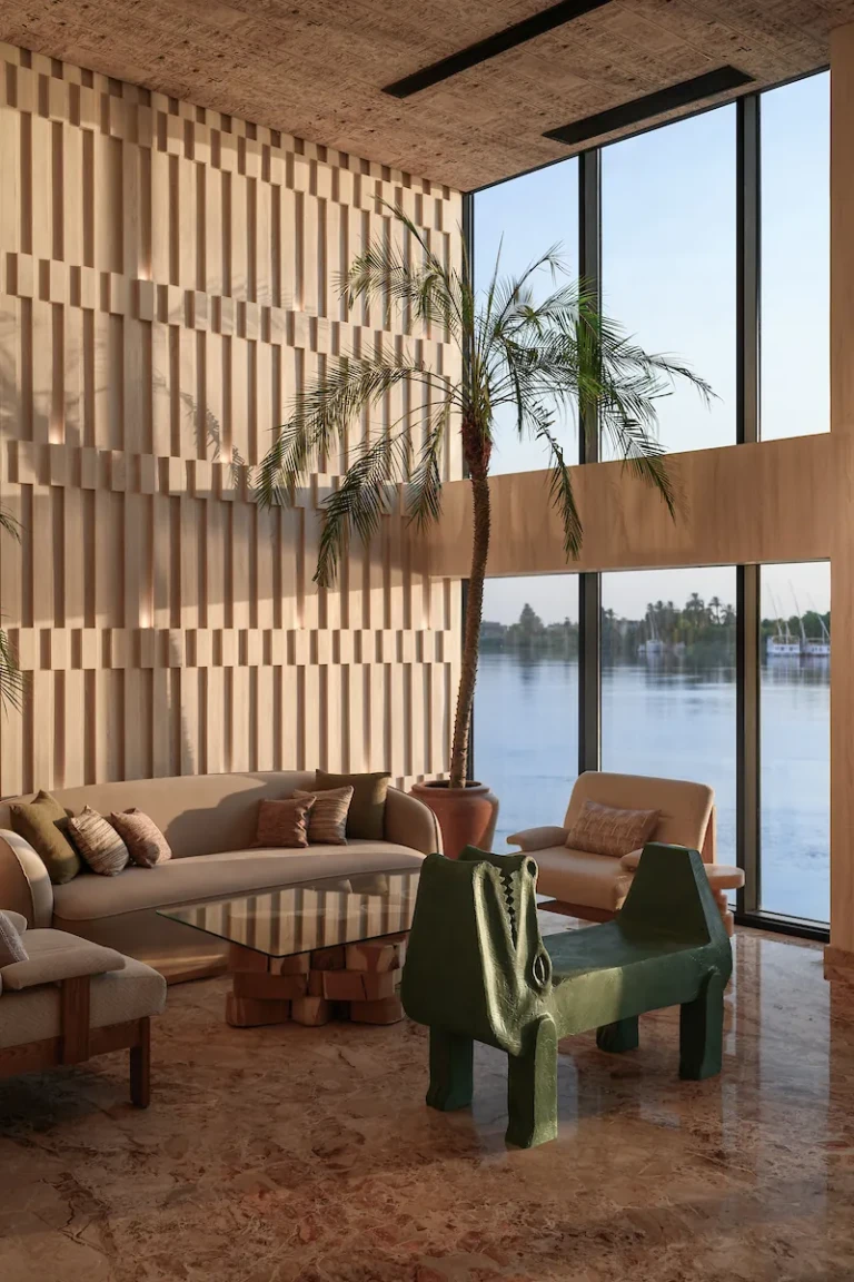 Soleil lounge seating area beside tall windows over the Nile