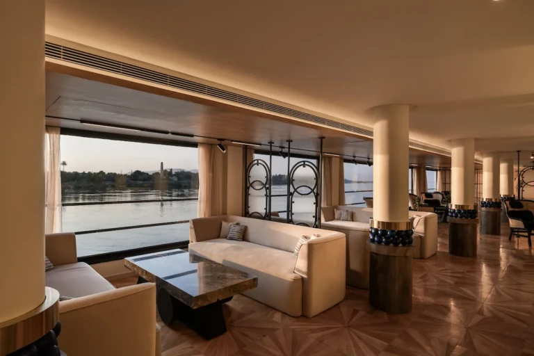 Soleil lounge with sofas and panoramic windows on the Nile