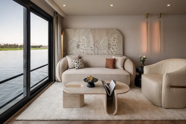 Soleil cabin lounge with sofa, armchair and Nile view windows