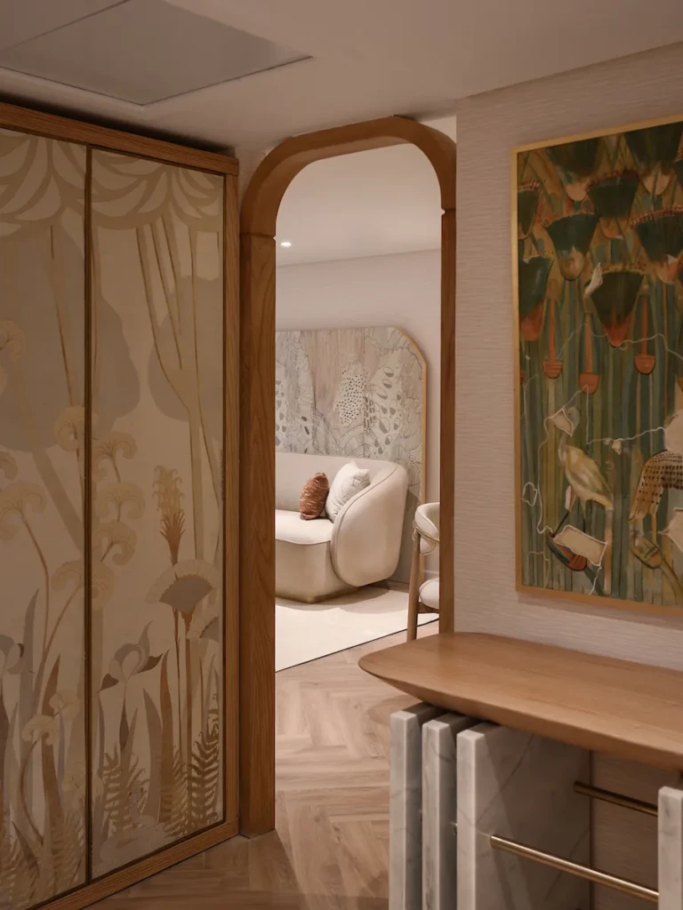 Arched doorway and painted wardrobe in a Soleil suite