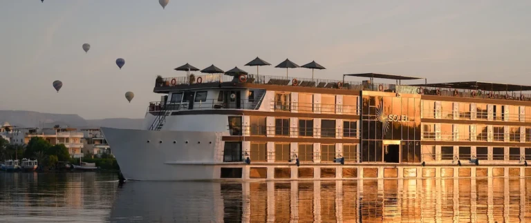 Soleil cruise ship on the Nile with hot air balloons at sunrise