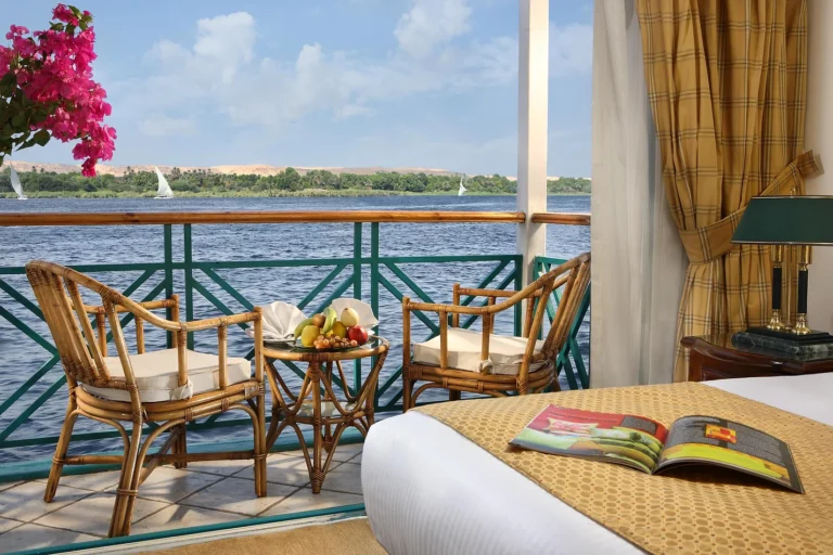 Balcony with two cane chairs overlooking the Nile on the Sonesta Moon Goddess