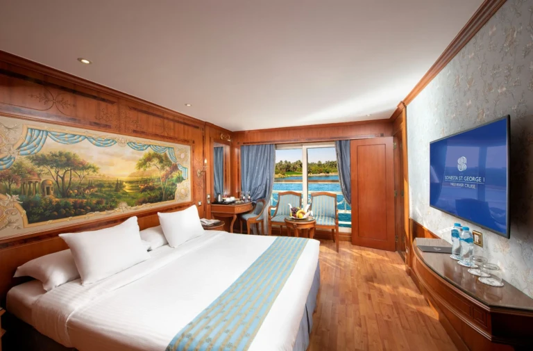 King bed cabin with Nile mural and blue curtains