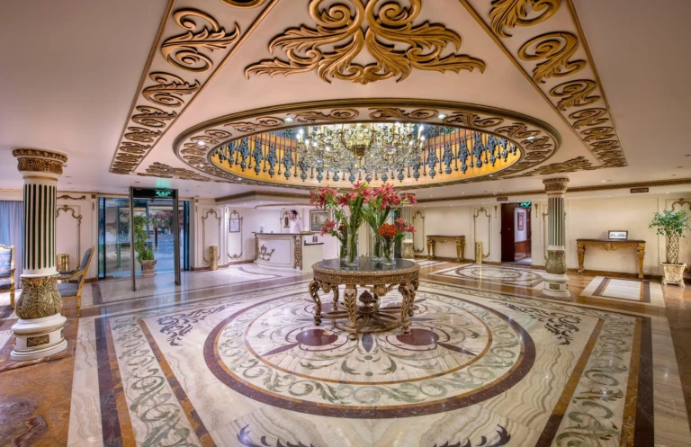 Reception lobby with marble mosaic floor and domed chandelier