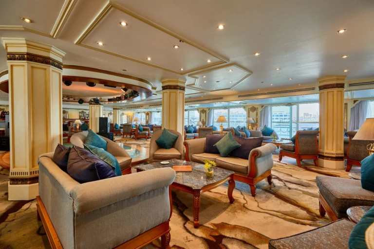Lounge sofas with teal cushions between columns