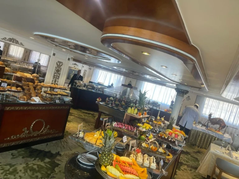 Breakfast buffet with fresh fruit display and pastries