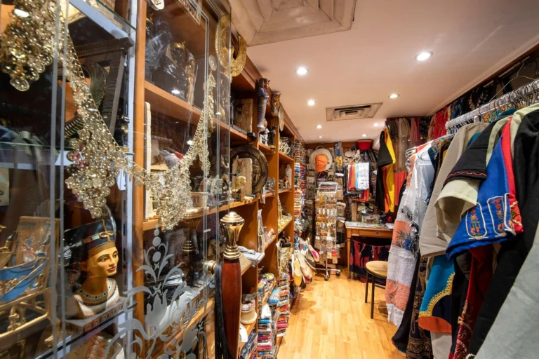 Souvenir shop with clothing racks and Egyptian figurines