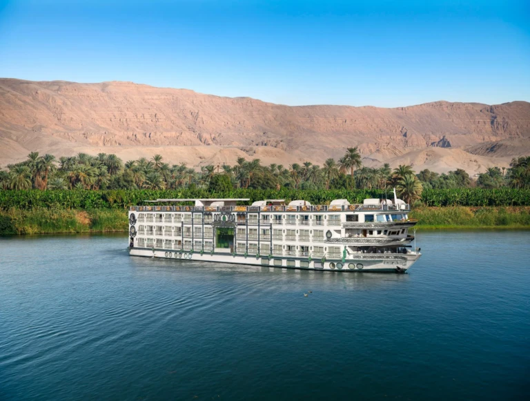 Sonesta St. George I sailing the Nile past palms and desert cliffs