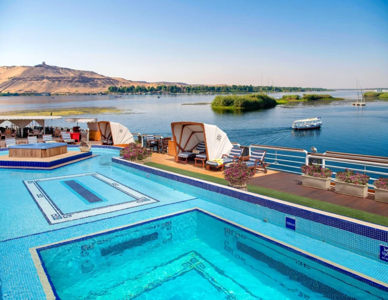 Upper deck pool and cabanas overlooking the Nile and desert hills