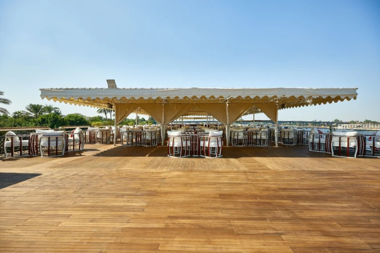 Sonesta St. George I open sun deck with canopy and dining tables