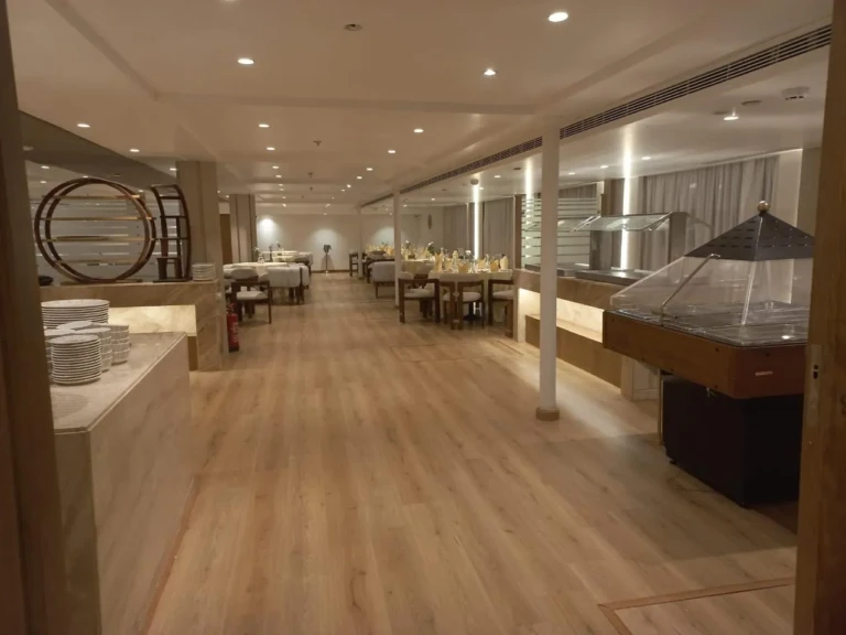 Sonesta Star Goddess restaurant with wooden floor and buffet counters