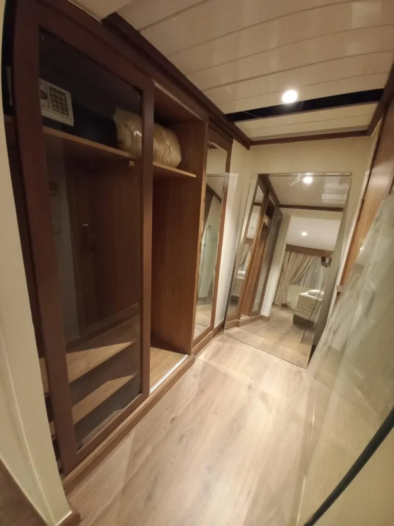 Wooden wardrobe and hallway in a Sonesta Star Goddess suite