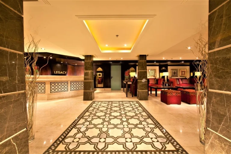 Steigenberger Legacy reception with mosaic floor and lounge beyond