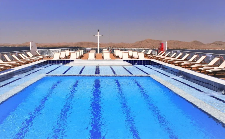 Swimming pool lined with sun loungers on the Steigenberger Legacy